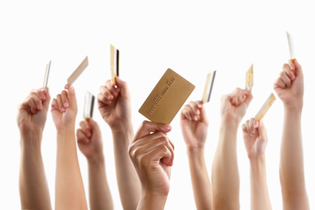 Credit cards held in the air