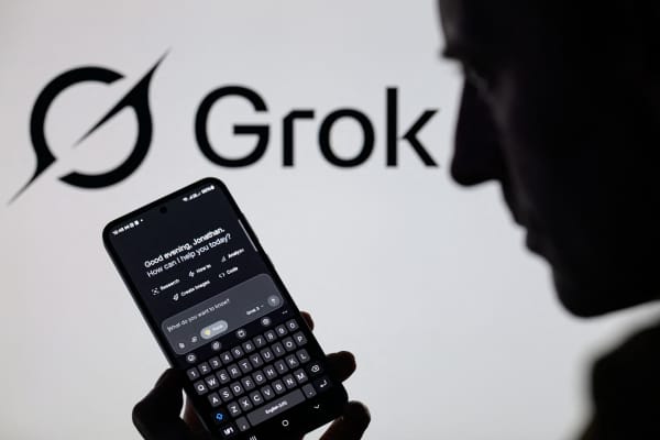 The Grok X AI app is used on a mobile phone with the Grok logo visible in the background on 8 March, 2025.