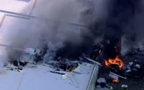 The crash sparked a fire at a shopping centre in Melbourne.