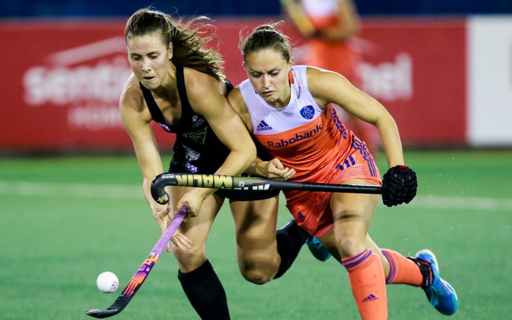 Black Sticks defender Rose Keddell does battle with a Dutch rival.
