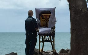 Queensland Ambulance Service paramedics brought the terminally ill woman to see the beach again.