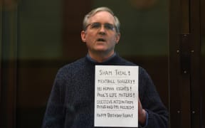 Paul Whelan, a former US marine accused of espionage and arrested in Russia in December 2018, stands inside a defendants' cage as he waits to hear his verdict in Moscow on 15 June 2020.