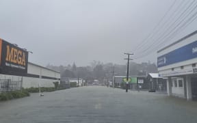 Porowini Avenue in central Whangarei under water on Monday.