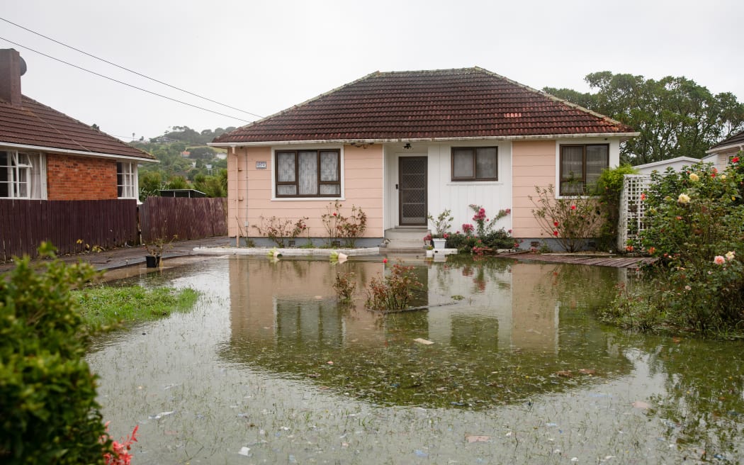 The home of Kannan Thiru was surrounded by a large pool of water still on Wednesday afternoon.
