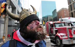Supporters and truckers front the Parliament Hill during a protest in downtown of Ottawa, Canada, on February 12, 2022.