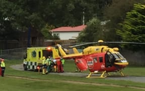 The injured road worker was taken to hospital in a helicopter.