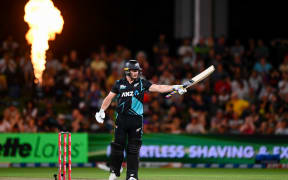 Glenn Phillips celebrates his 50 at Hagley Oval.