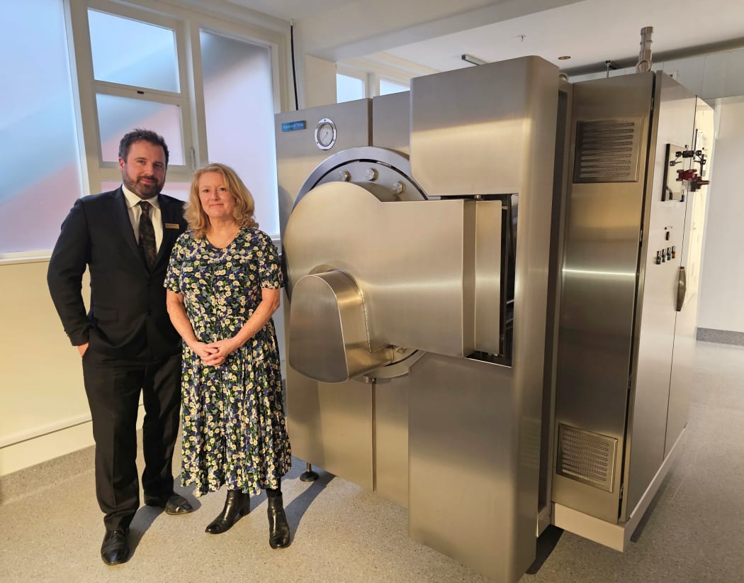 Andrew Bell and Deborah Richards with the "Resomator" - the machine used for water cremations.