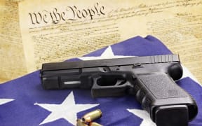 The constitutionality of CNMI's new gun laws is being questioned.