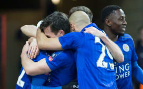 Leicester City players celebrate.