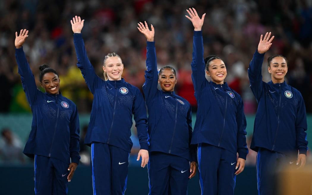 Members of the United States celebrate during an award ceremony of the women's artistic gymnastics team in the Paris Olympics at the Bercy Arena in Paris, France, on July 30, 2024. U.S. Team won the event to claim gold medal.( The Yomiuri Shimbun ) (Photo by Kaname Muto / Yomiuri / The Yomiuri Shimbun via AFP)
