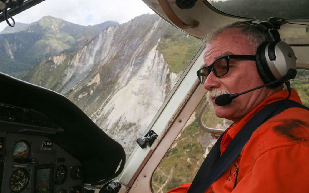 Helicopter pilot Jurgen Ruh flying past a landslide near Kombul village caused by a massive 7.6 magnitude earthquake, which struck September 11 in Papua New Guinea killing seven people.