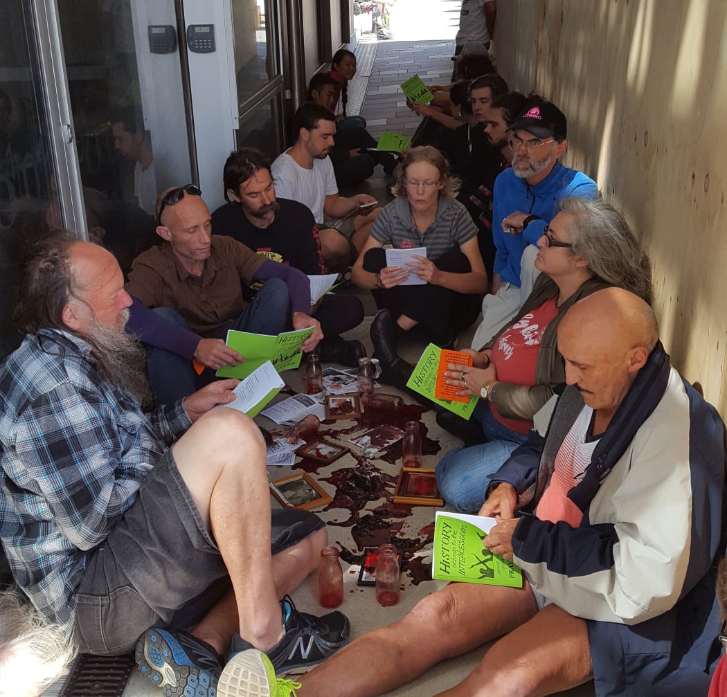 Protesters spilled their own blood on the ground outside the GCSB headquarters in Wellington.