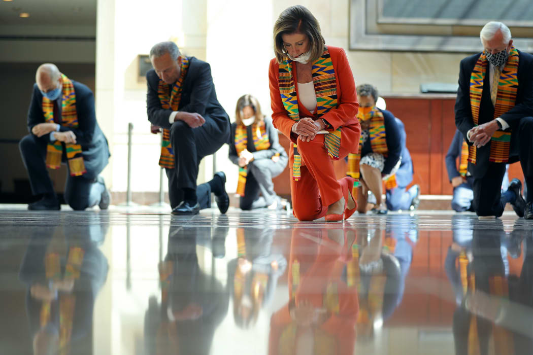 Senator Cory Booker, Senate Minority Leader Charles Schumer, Senator Kamala Harris, Speaker of the House Nancy Pelosi, Rep. Karen Bass and House Majority Leader Steny Hoyer join fellow Democrats to kneel in silence to honour George Floyd on 8 June, 2020.