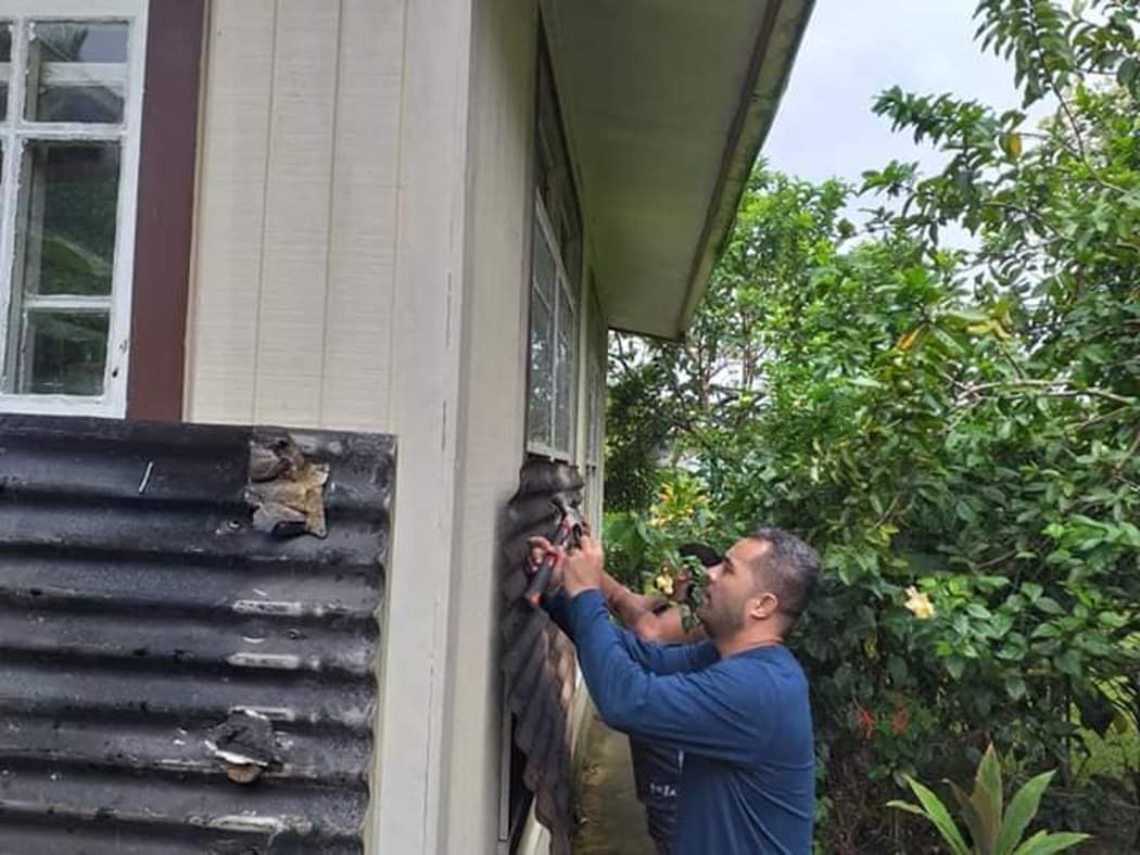CIVA team putting up shutters before Tropical Cyclone Harold arrives in Tonga