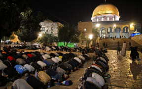 Palestinians pray outside Jerusalem's Al-Aqsa Mosque during the holy Night of Destiny, Laylat al-Qadr.
