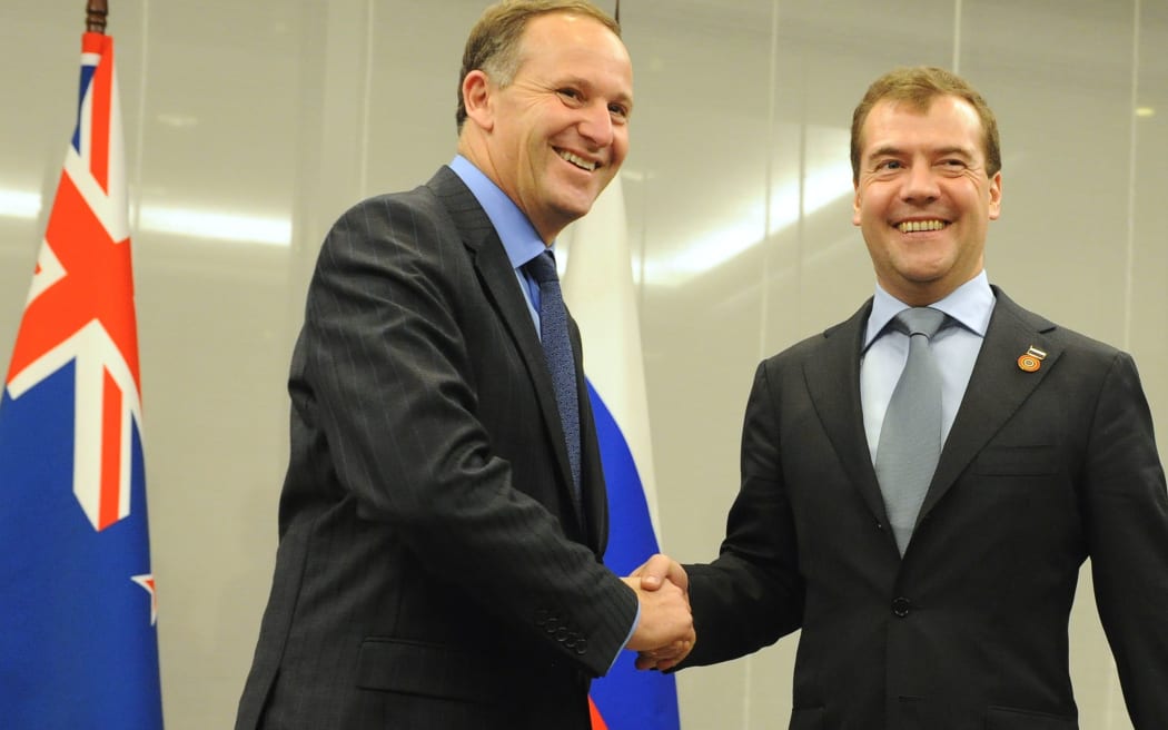 John Key shakes hands with Dmitry Medvedev at a bi-lateral meeting in Japan after trade talks started in 2010.