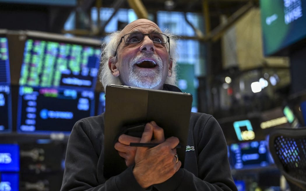 A trader works on the floor of the New York Stock Exchange (NYSE) during afternoon trading on April 9, 2025 in New York. Wall Street stocks rocketed to close solidly higher Wednesday, with dramatic advances on all three major indexes as US President Donald Trump delayed steep new tariffs hours after they took effect. The Dow Jones Industrial Average surged 7.9 percent to 40,608.45, the broad-based S&P 500 Index rallied 9.5 percent to 5,456.90, and the tech-focused Nasdaq Composite Index jumped more than 12.2 percent to 17,124.97. (Photo by ANGELA WEISS / AFP)