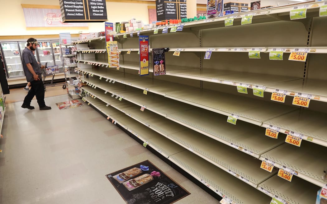 A store's bread shelves are bare as people stock up on food ahead of the arrival of Hurricane Florence.