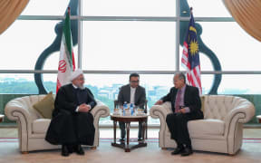 Iran's President Hassan Rouhani (L) meets Malaysian Prime Minister Mahathir Mohamad (R) in Kuala Lumpur, Malaysia.