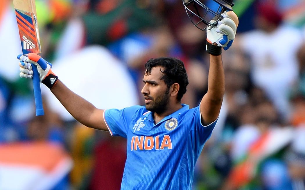 India's Rohit Sharma celebrates scoring a century.