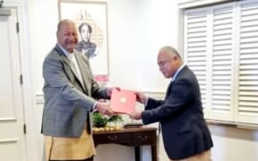 King Tupou VI (L) officially appoints 'Aisake Eke as Tonga's prime minister