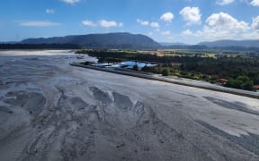 An aerial view this week looking down the true right bank of the Waiho (Waiau) River with the Westland District Council's sewerage ponds sitting prone in the riverbed, with the 'Havill Wall' along the edge of the river.