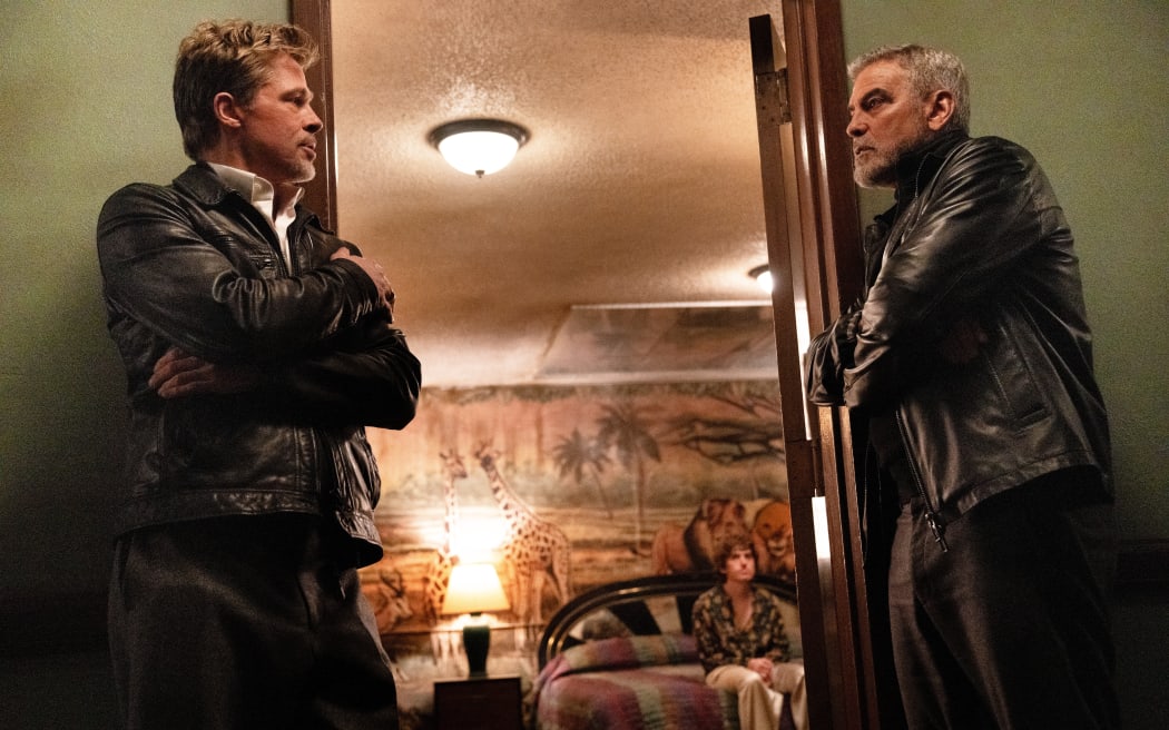 Brad Pitt, Austin Abrams and George Clooney in 'Wolfs'.
