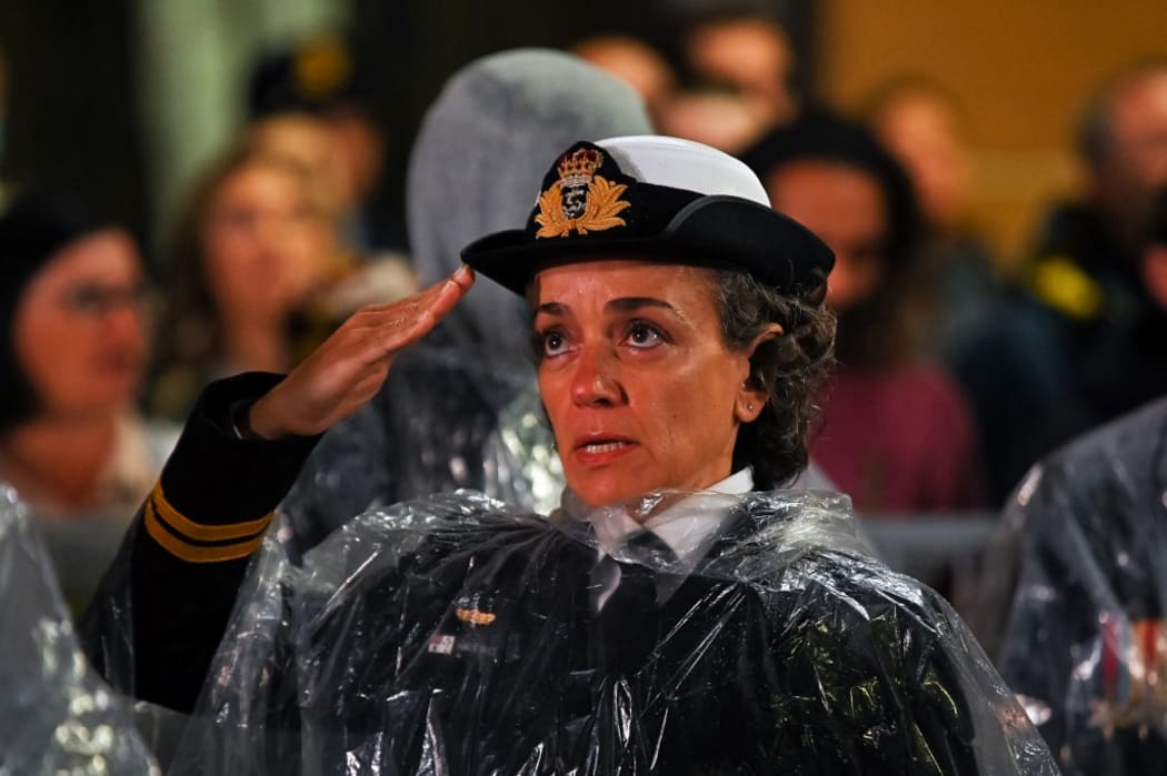 A  member of the Australian Defence Force salutes next to the Cenotaph during the annual ANZAC (Australian and New Zealand Army Corps) Day dawn service in Sydney on April 25, 2022.