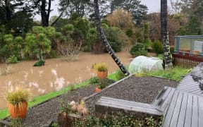 A flooded back yard in Kumeū.