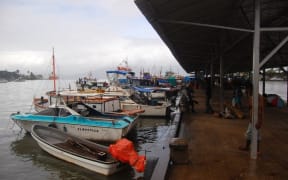 Boats at the port of Alotau in Milne Bay Province, Papua New Guinea, 2011.