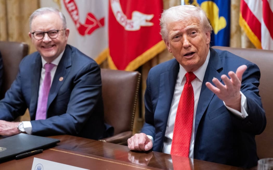 US President Donald Trump (R) speaks with Australia's Prime Minister Anthony Albanese in the Cabinet Room at the White House in Washington, DC, on 20 October, 2025.