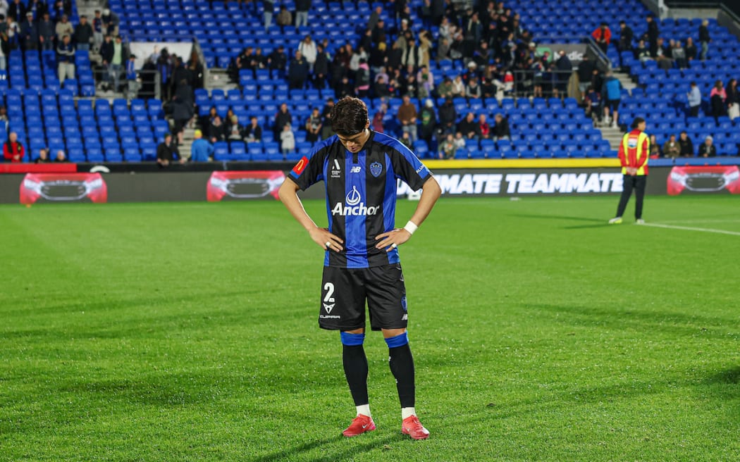 Auckland FC's Hiroki Sakai dejected after their semi-final loss to the Melbourne Victory.