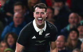 Will Jordan celebrates scoring a try for the All Blacks.