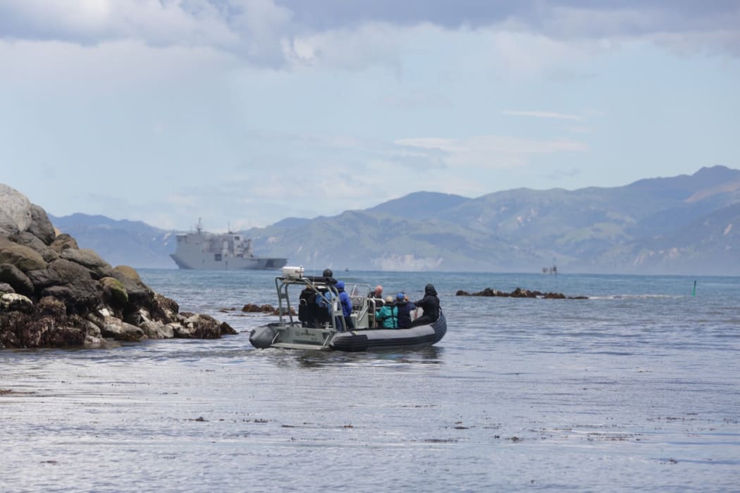 Another load of people are transported to HMNZS.
