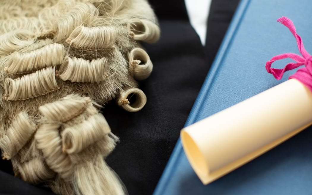 Legal Concept Still Life Of Barristers Wig With Gown And Brief