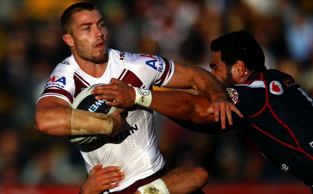 Sea Eagles' Kieran Foran is tackled by Warriors' Konrad Hurrell. Round 13 NRL Telstra Premiership game, Vodafone Warriors v Manly-Warringah Sea Eagles, Mt Smart Stadium, Auckland, New Zealand. Sunday 9th June 2013.
