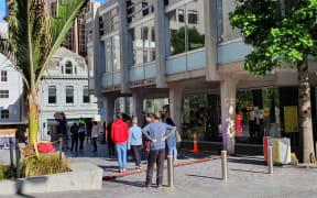 People wait in line at a pop-up Covid-19 testing centre at Freyberg Place in Auckland's CBD on Friday 13 November.