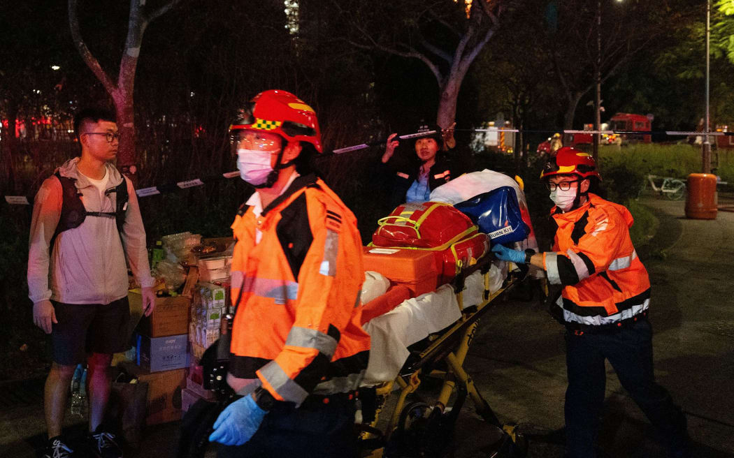 Rescue workers arrive on the scene during a fire at residential buildings in Wang Fuk Court, in the Tai Po district of Hong Kong, on November 26.