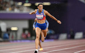 Sydney McLaughlin-Levrone crosses the finish line to win in the women's 400m final during the World Athletics Championships in Tokyo on September 18, 2025. (Photo by Jewel SAMAD / AFP)