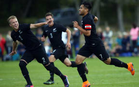 Bill Tuiloma (R) and team-mates celebrate his opening goal