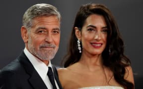 Actor George Clooney and his wife barrister Amal Clooney pose on the red carpet at the London Film Festival, on 10 October.