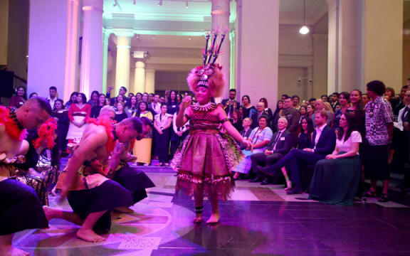 Duchess of Sussex Meghan and Prince Harry watch a cultural performance as they attend the Auckland War Memorial Museum.