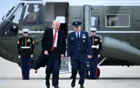 US President Donald Trump walks to board Air Force One at Joint Base Andrews in Maryland on March 14, 2025. Trump is spending the weekend at his Florida Mar-a-Lago resort. (Photo by Brendan SMIALOWSKI / AFP)