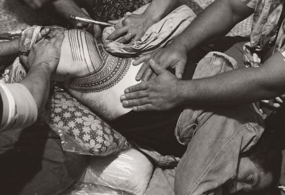 NZ artist Tony Fomison receiving his pe'a. Image from 'Tatau - A History of Samoan Tattooing'