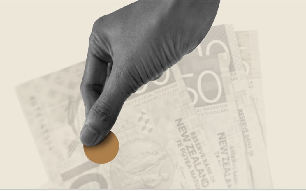 Composite of hand pinching coin with banknotes in background.