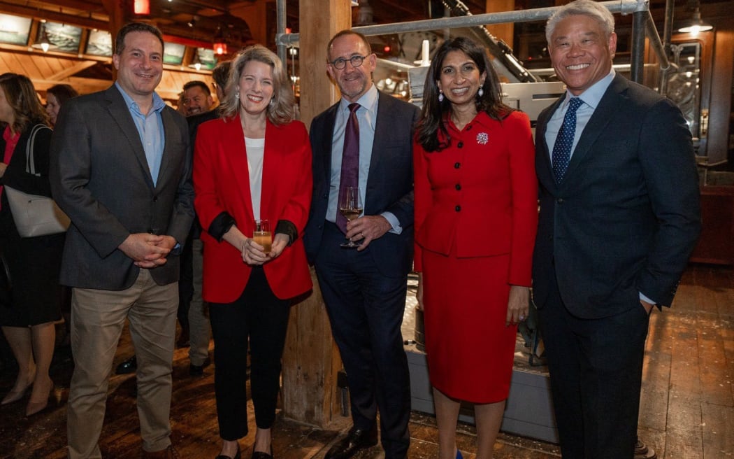 The UK's Suella Braverman with Andrew Little and other officials.
