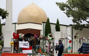 An armed police officer outside Al Noor Mosque in Christchurch, April 2019.