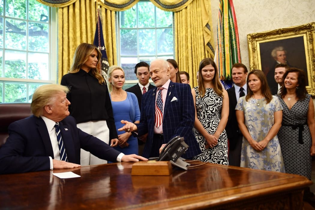 US President Donald Trump speaks with Apollo 11 crew member Buzz Aldrin at the White House during a ceremony commemorating the 50th anniversary of the Moon landing.