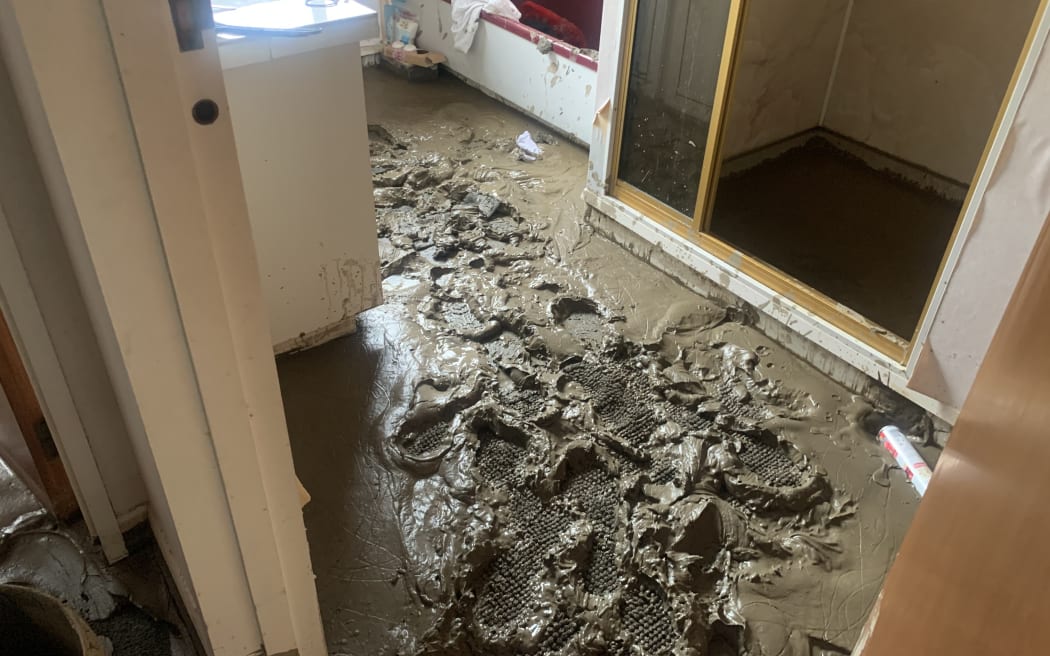 Qian Zhang's Taradale house was covered with at least three inches of silt after Cyclone Gabrielle.